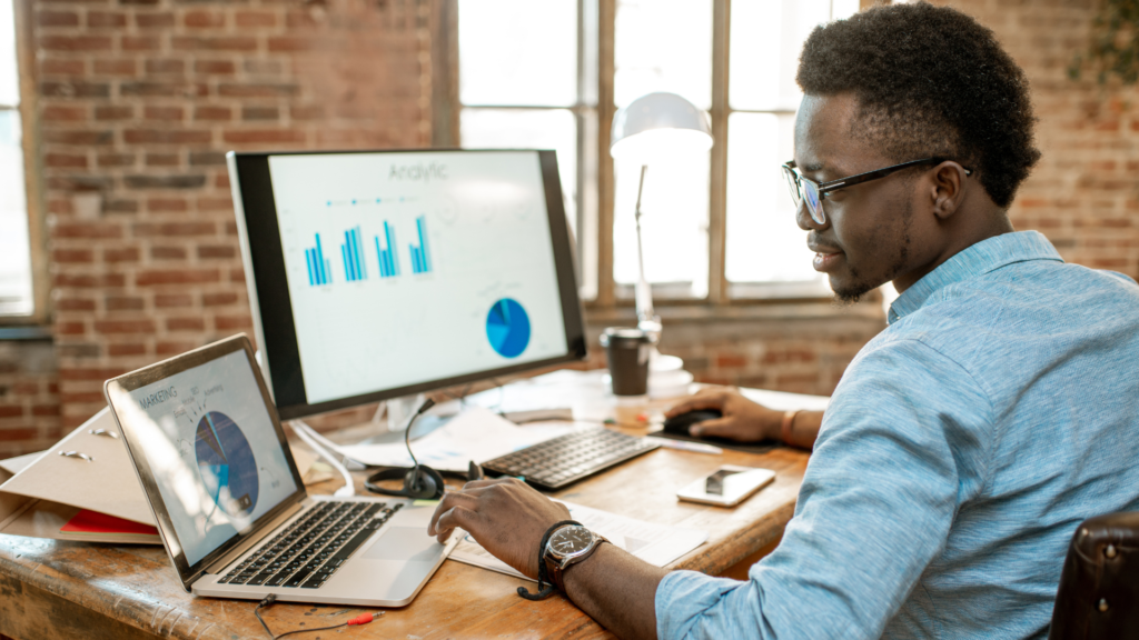 Man looking at analytics on a computer